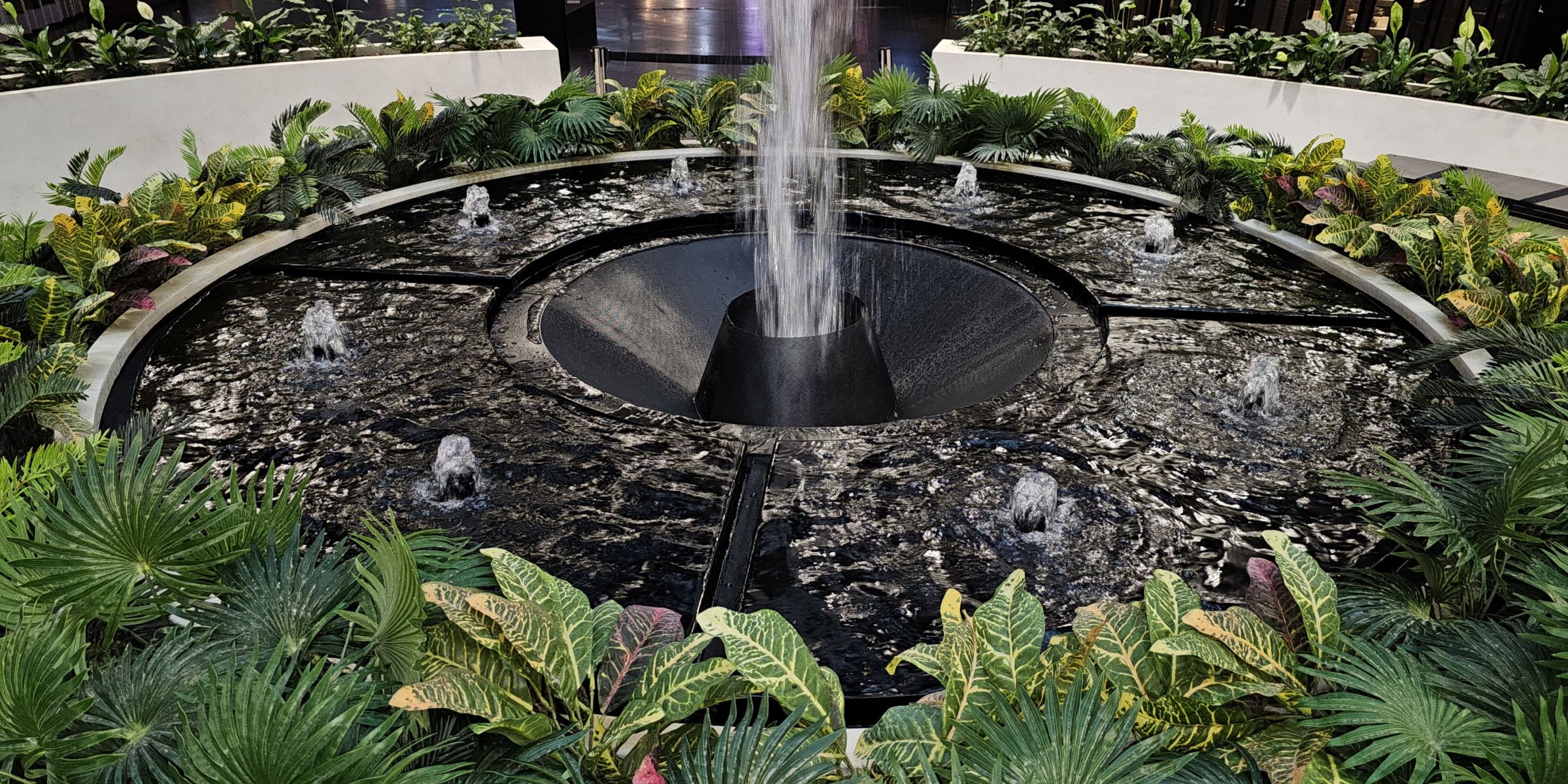 Custom LICOM76 & Stainless steel water fountain spillway with lightweight seating on level 2 Highpoint by H2O Designs, Melbourne